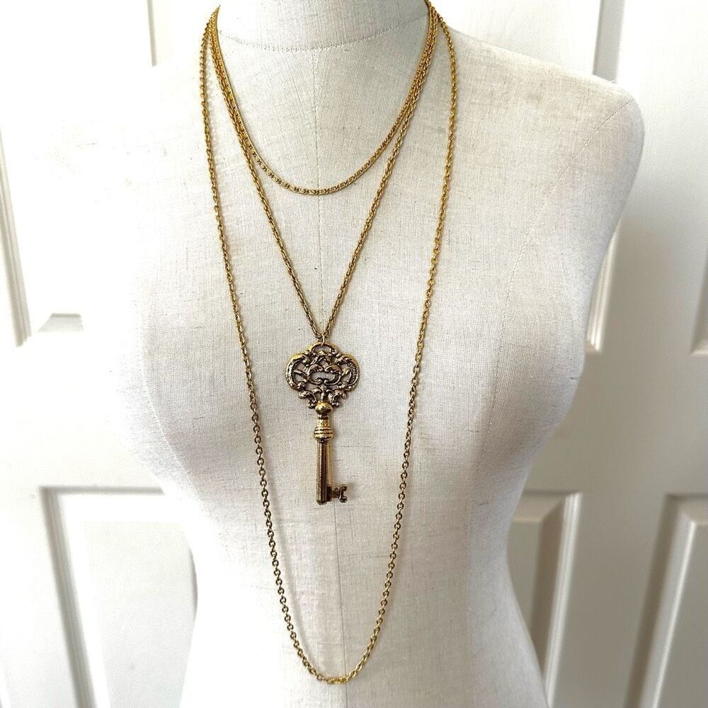 Sumthing Special multi chain gold tone key pendant necklace